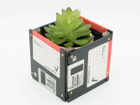 Floppy disks can become cute little houseplant vessels.